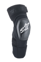 Ginocchiere Alpinestars A-Impact Plasma Elite Shield, nere con logo a stella bianco, guscio esterno rigido in TPU, tessuto mesh con cinturino superiore regolabile, design ergonomico pre-curvato, protezione per MTB e fuoristrada