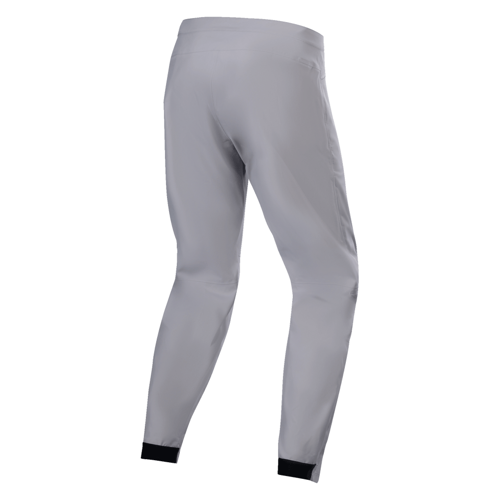 Pantaloni impermeabili Alpinestars A-Dura, pantaloni da MTB, grigio titanio, vista posteriore, con gambe affusolate e polsini elastici neri, design tecnico minimalista per mountain bike