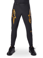 Alpinestars A-Supra Race Pants, pantaloni da ciclismo MTB, nero con vistosi loghi arancioni, dotati di chiusura a cricchetto in vita e ventilazione traforata al laser, vestibilità performance per gare di mountain bike fuoristrada