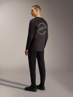 Alpinestars A-Dura Air, maglia nera a maniche lunghe con grafica circolare Racing Ahead sul retro, stile MTB.