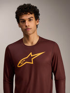 Maglia MTB Alpinestars A-Dura Ride bordeaux a maniche lunghe con logo giallo sul petto.