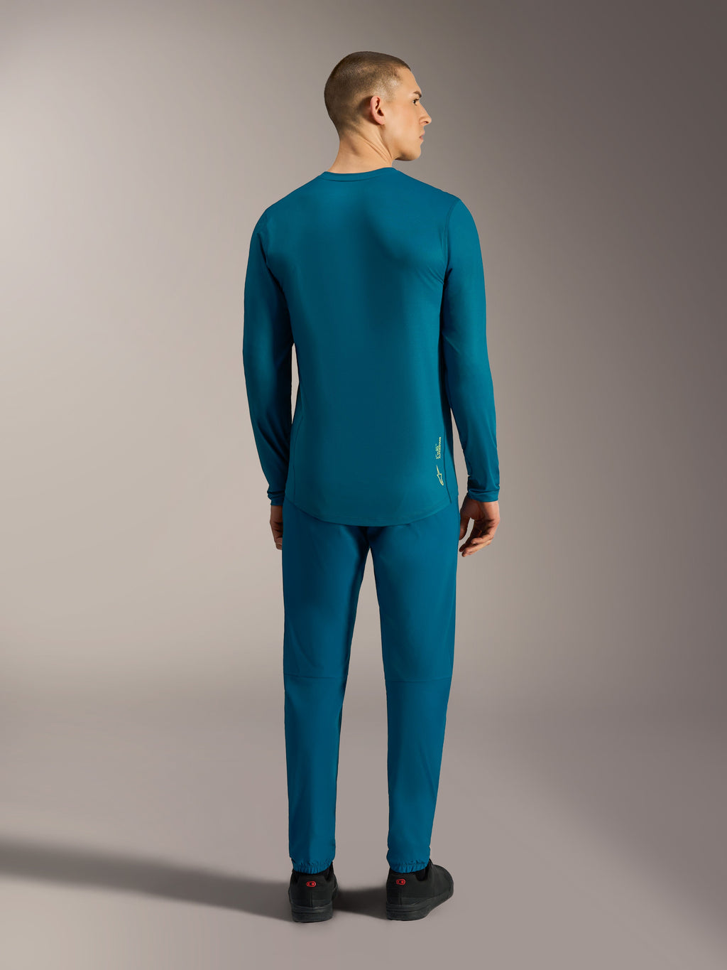 Alpinestars A-Dura Ride Maglia a maniche lunghe blu-verde, vista posteriore con coda allungata per MTB