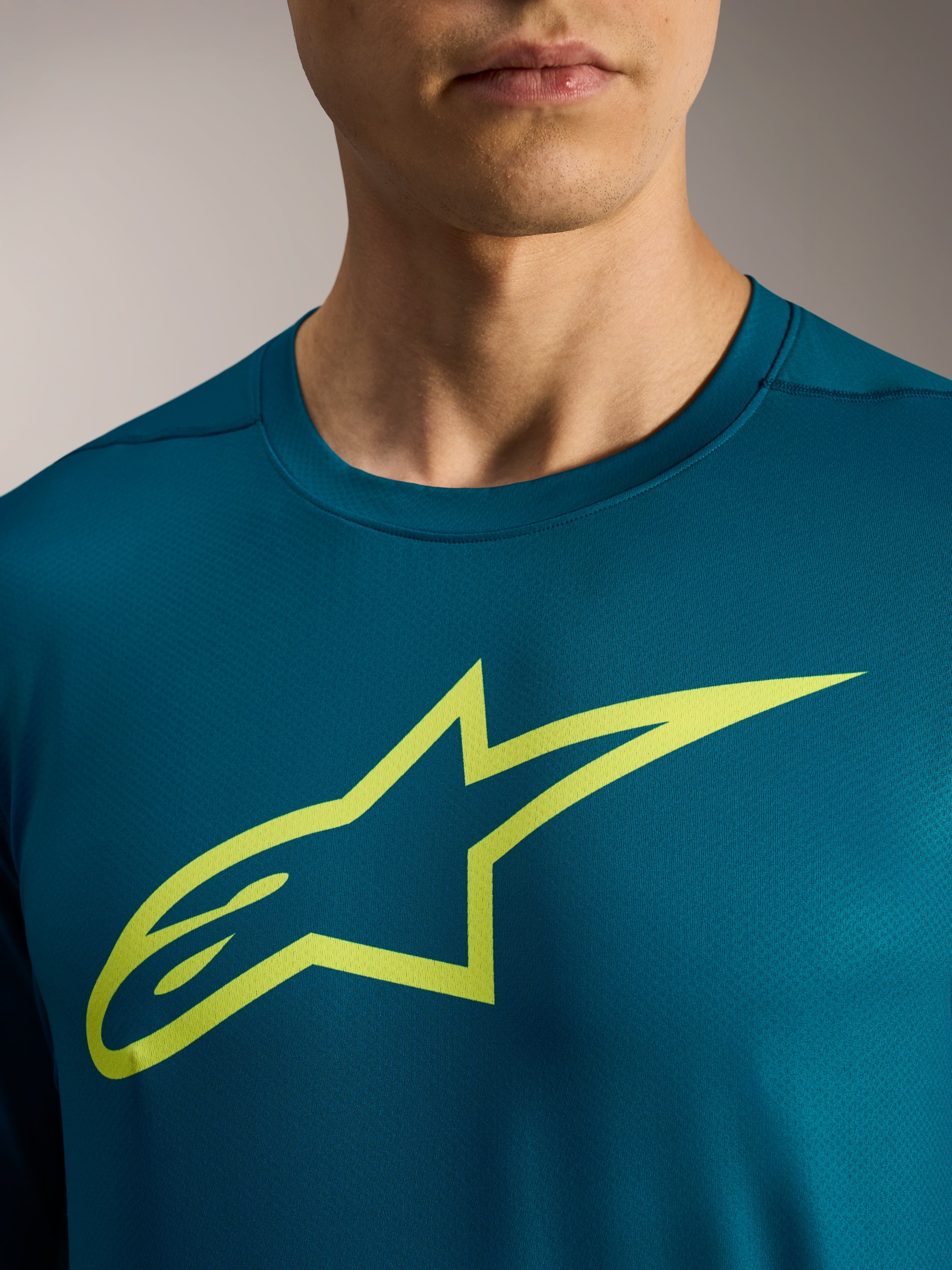 Maglia a maniche lunghe A-Dura Ride blu-verde con logo Astars lime sul petto, abbigliamento tecnico MTB.