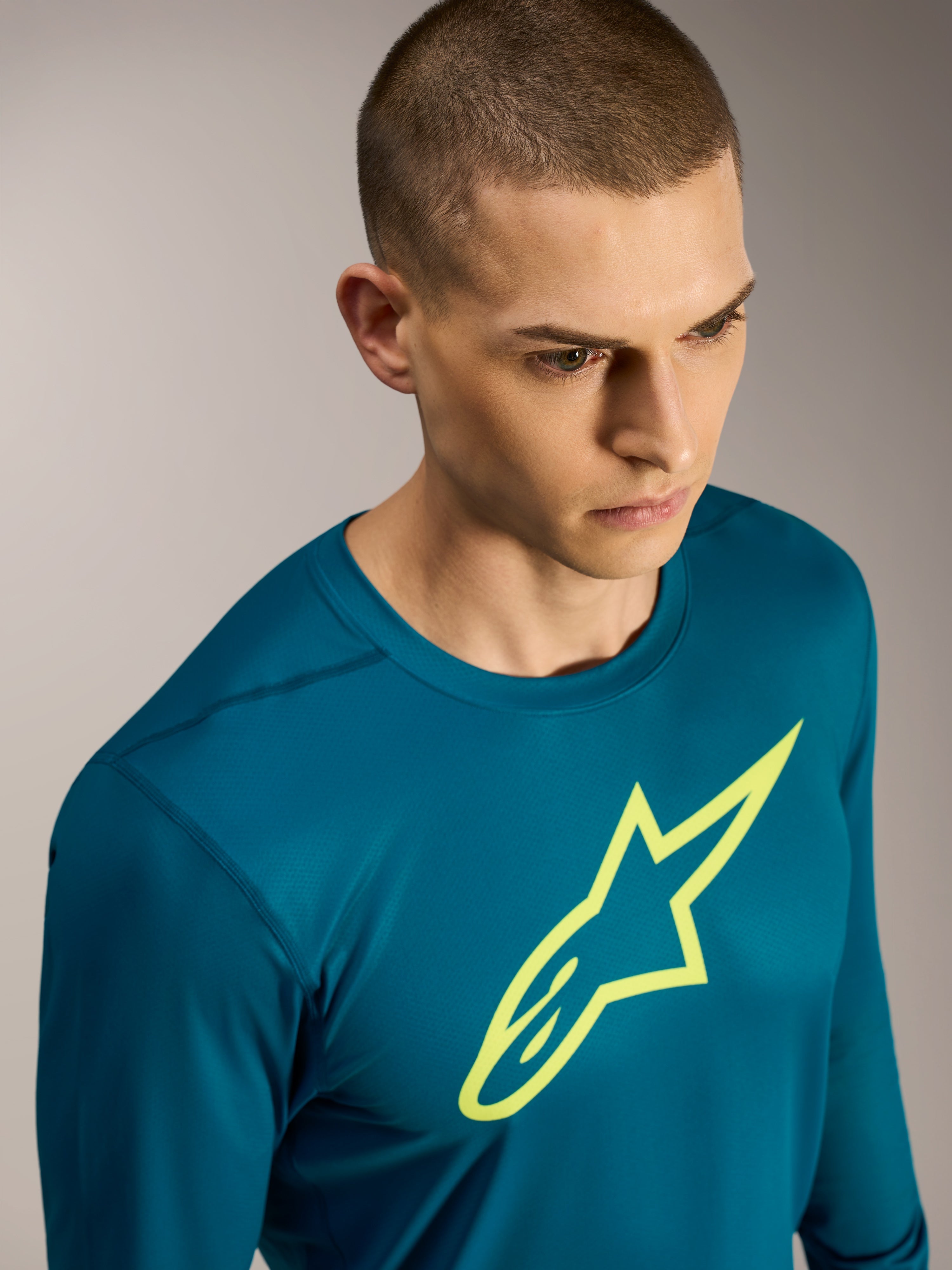 Alpinestars A-Dura Ride Maglia a maniche lunghe, top MTB verde-blu con logo Astars giallo e tessuto stretch