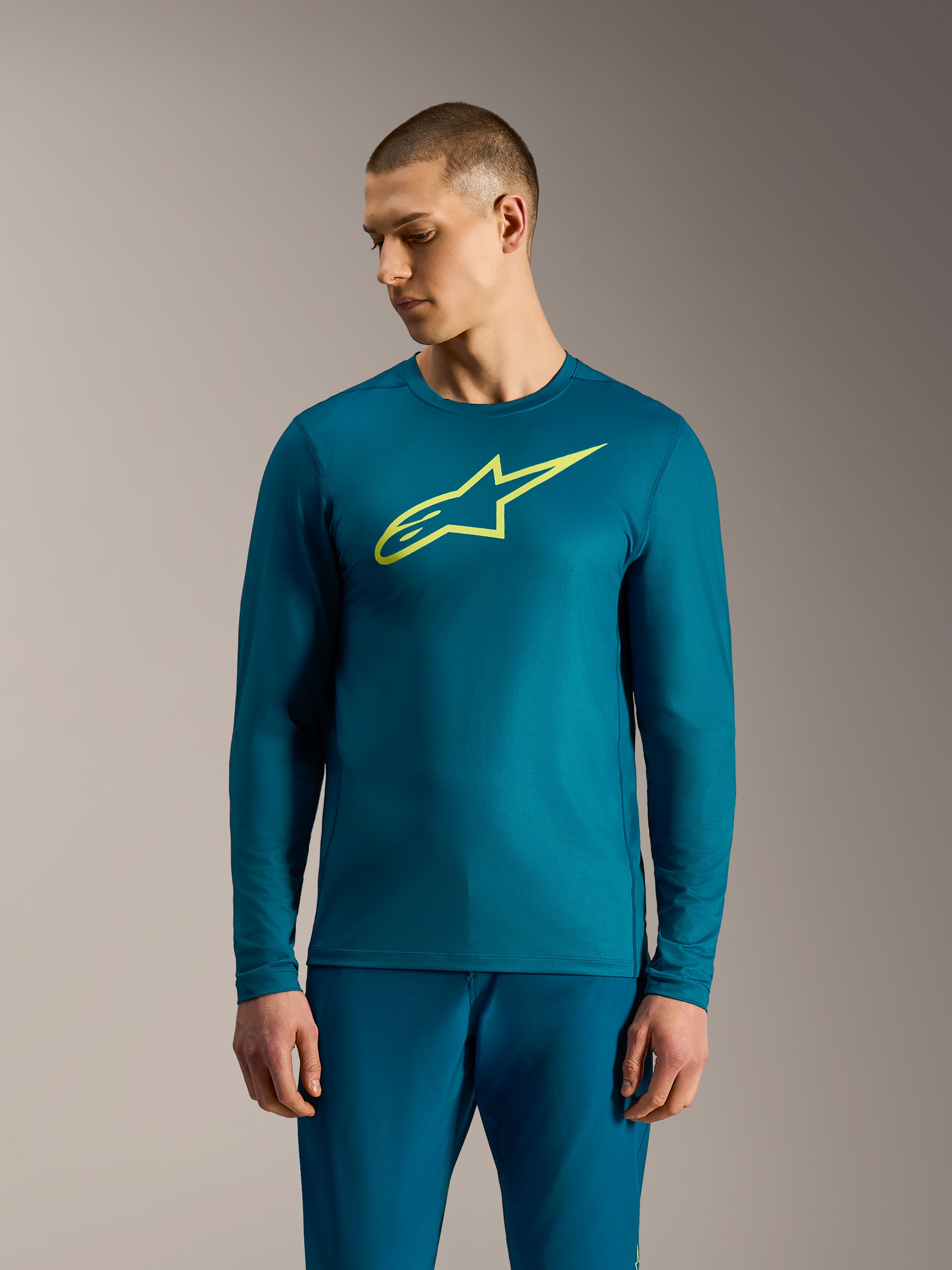 Maglia a maniche lunghe A-Dura Ride blu-verde con logo Alpinestars giallo lime, abbigliamento tecnico da mountain bike.