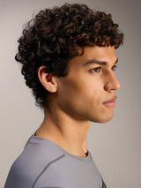 Maglia Alpinestars A-Dura Ride grigia, primo piano di profilo con girocollo sportivo e tessuto traspirante.