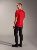 Maglia Alpinestars A-Dura Ride rossa, vista posteriore con orlo allungato e tessuto elasticizzato per MTB.