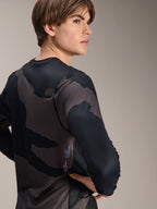 Alpinestars A-Dura Hollow Camo Long Sleeve Jersey, Black Camo, modello maschile visto di spalle, con motivo mimetico scuro e marchio stampato sulla parte bassa della schiena, maglia tecnica da MTB a maniche lunghe