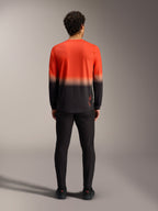 Maglia Alpinestars A-Dura ASTARS 2.0 sfumata arancione e nera, vista posteriore del modello da MTB a maniche lunghe.