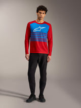 Maglia Alpinestars A-Dura Elite 2.0, top MTB rosso a maniche lunghe con pannello blu, logo bianco e accenti a righe.