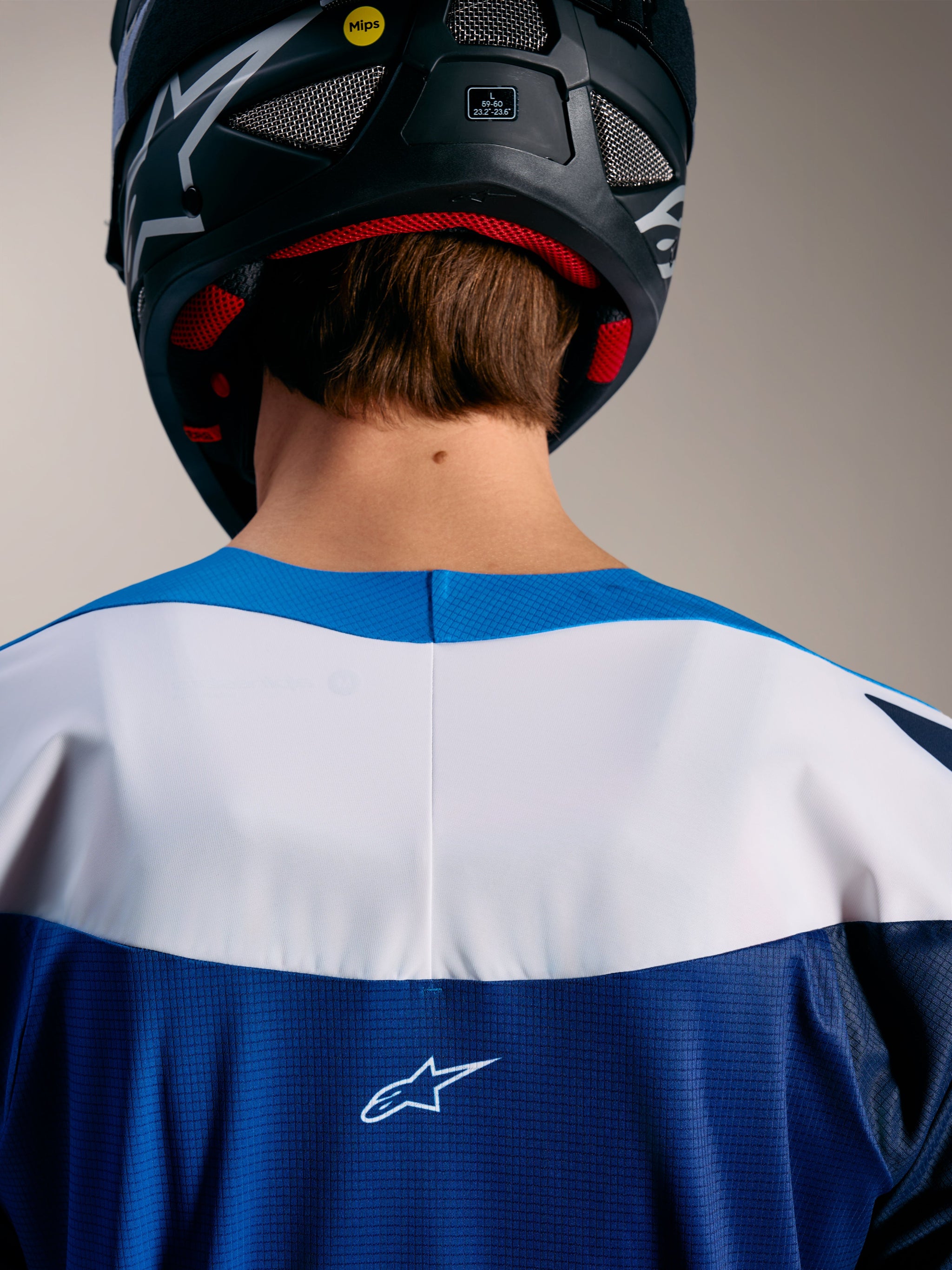 Maglia Alpinestars A-Supra Elite blu e bianca, colletto termosaldato e logo ASTARS sulla parte superiore della schiena.