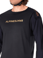 Maglia a maniche lunghe Alpinestars A-Aria Polartec Switch, nero, con logo Alpinestars color bronzo sul petto e sulla spalla, perforazioni laser sulle maniche per la ventilazione, abbigliamento tecnico da MTB