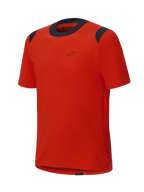 Maglia a maniche corte Alpinestars A-Dura Dri Wool, arancione Spicy Orange con pannelli in rete neri su colletto e spalle, design minimalista con piccolo logo sul petto, abbigliamento tecnico da mountain bike