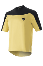 Alpinestars Drop Meta Jersey - manica corta, maglia da ciclismo MTB, oro e nero, costruzione in rete con spalle a contrasto, logo circolare sul petto e bordo posteriore allungato.