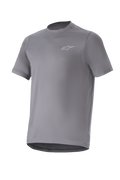 Alpinestars A-Dura Astar Jersey, maglia da mountain bike a maniche corte, grigio scuro con piccolo logo argento sul petto, girocollo e bordo posteriore allungato, tessuto tecnico traspirante, trail riding MTB