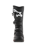 Alpinestars Tech-T Boots, stivali da moto per trial, nero e rosso, vista frontale con placca paratibiale ergonomica e logo Astar bianco, sistema di chiusura a tre ganci e robusta struttura in pelle con dettaglio rosso sulla suola