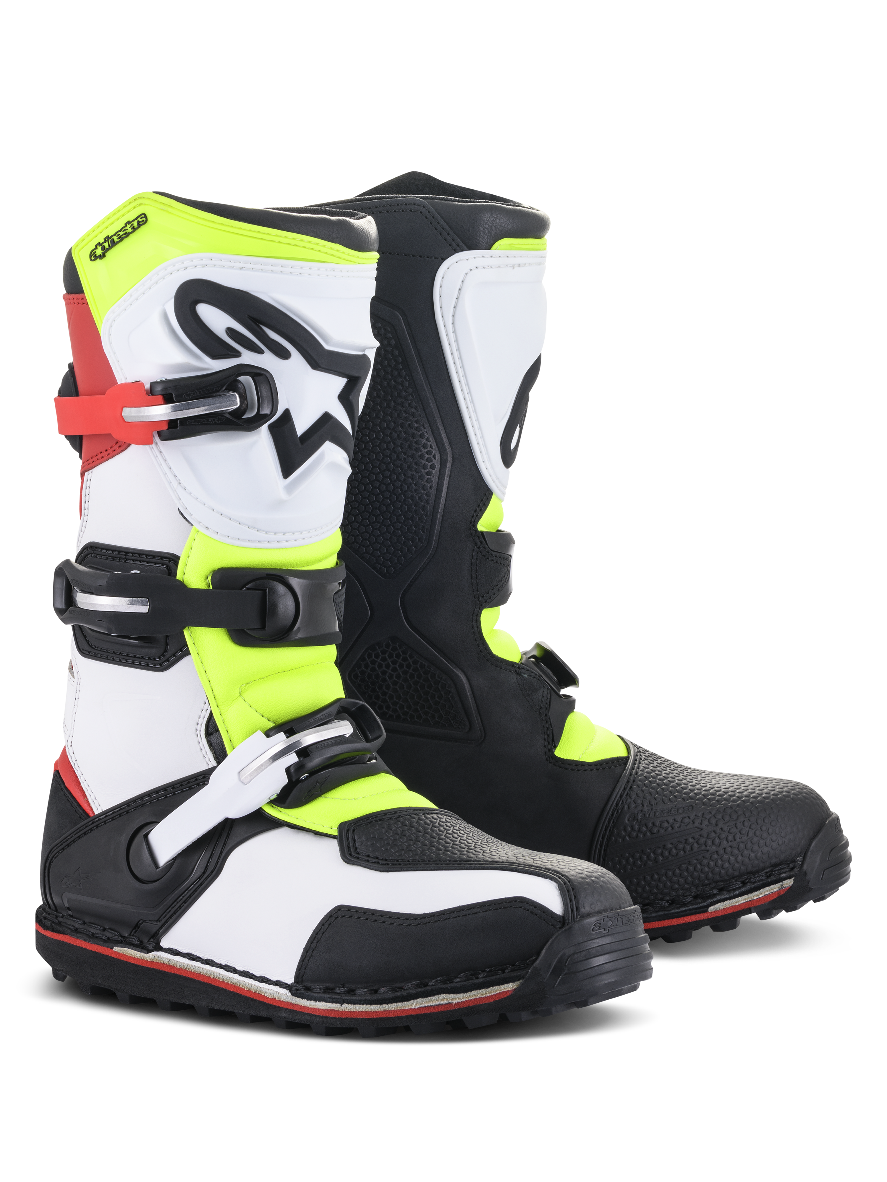 Stivali Alpinestars Tech-T, calzature da moto trial, bianco, rosso, giallo fluo e nero, con paratibia ergonomica e logo a stella, chiusure a fibbia e suola specializzata per il fuoristrada tecnico