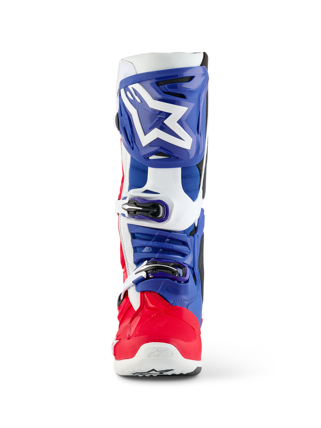 Stivale Alpinestars Limited Edition Fortitude Tech 10, stivale da motocross, rosso acceso, bianco e blu, vista frontale con grande logo a stella bianco sulla placca tibiale blu, sistema di chiusura a tripla fibbia e scocca del piede rosso vibrante, progettato per prestazioni off-road d'élite