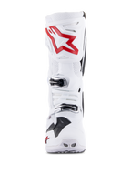Stivali Alpinestars Tech 10 Supervented, bianco e rosso acceso, vista frontale con pannelli traforati ventilati, grande logo a stella rossa sulla placca tibiale, fibbie argentate regolabili, design da motocross ad alte prestazioni