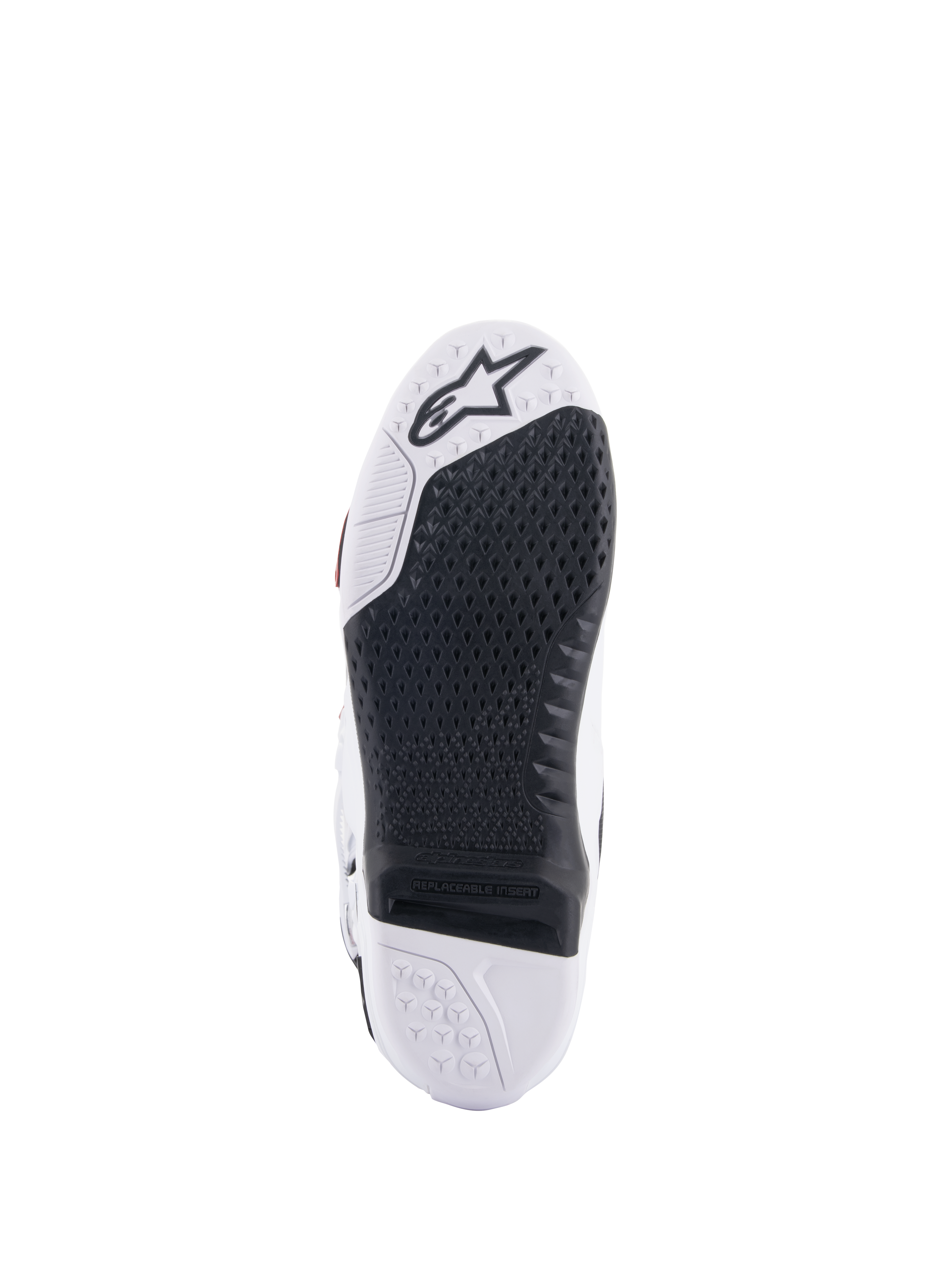 Stivali Alpinestars Tech 10 Supervented, vista della suola bianca e nera, con design a nido d'ape allungato, inserto centrale sostituibile nero, punta bianca con logo a stella Alpinestars, ottimizzati per il controllo sulle pedane da motocross.