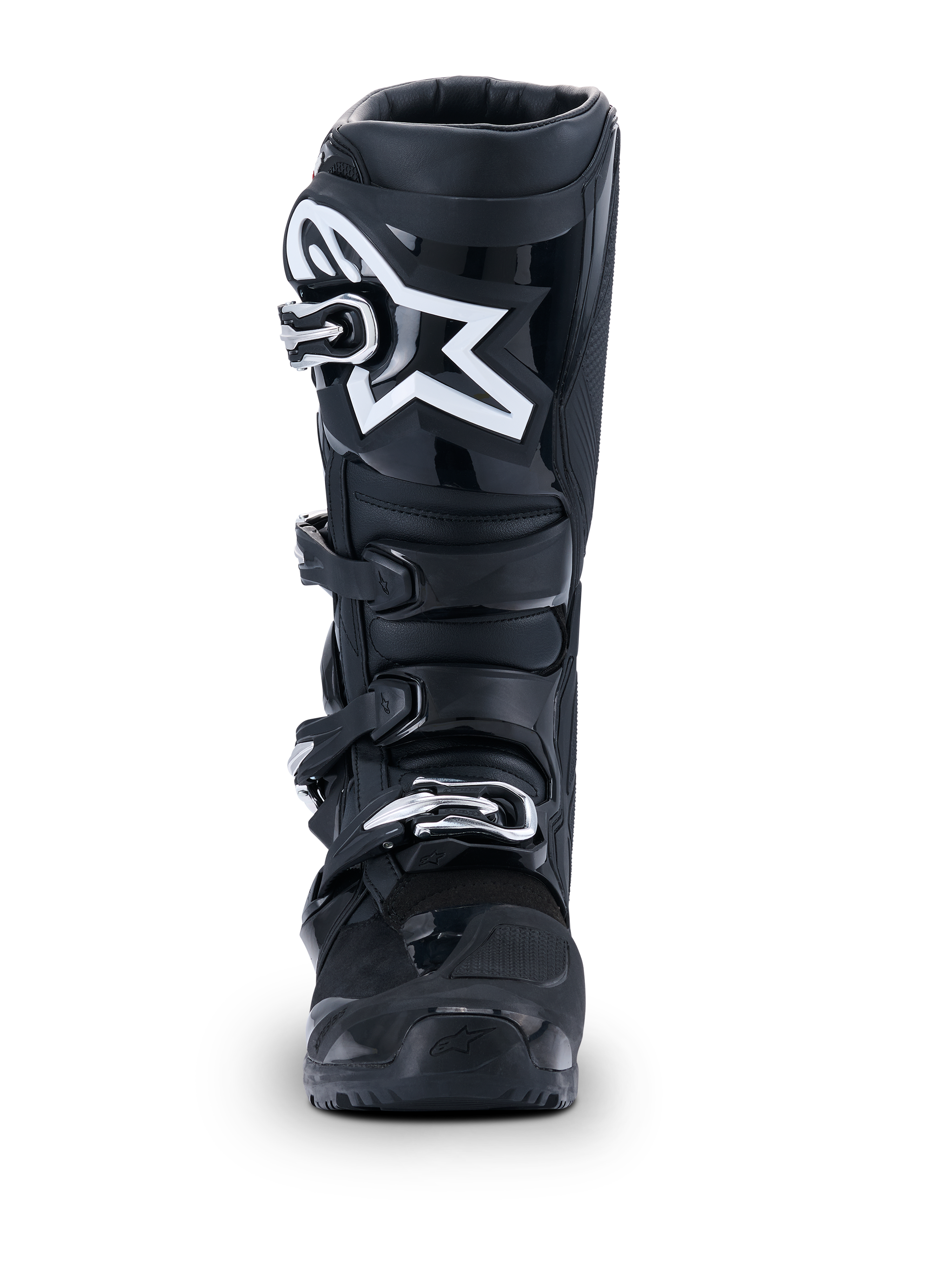 Alpinestars Stivali Tech 7 Enduro Drystar® 2026, stivali da motocross neri, vista frontale, con sistema di chiusura a quattro fibbie resistente e visibile logo a stella bianco sullo stinco, progettati per prestazioni off-road ed enduro