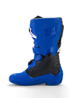 Alpinestars Yamaha Youth Tech 7S Boots, stivali da motocross per ragazzi, blu con accenti neri e bianchi, vista di profilo, con logo 'Tech Series' in rilievo, pannelli protettivi in TPU, sistema di chiusura con fibbie e suola blu resistente per prestazioni off-road