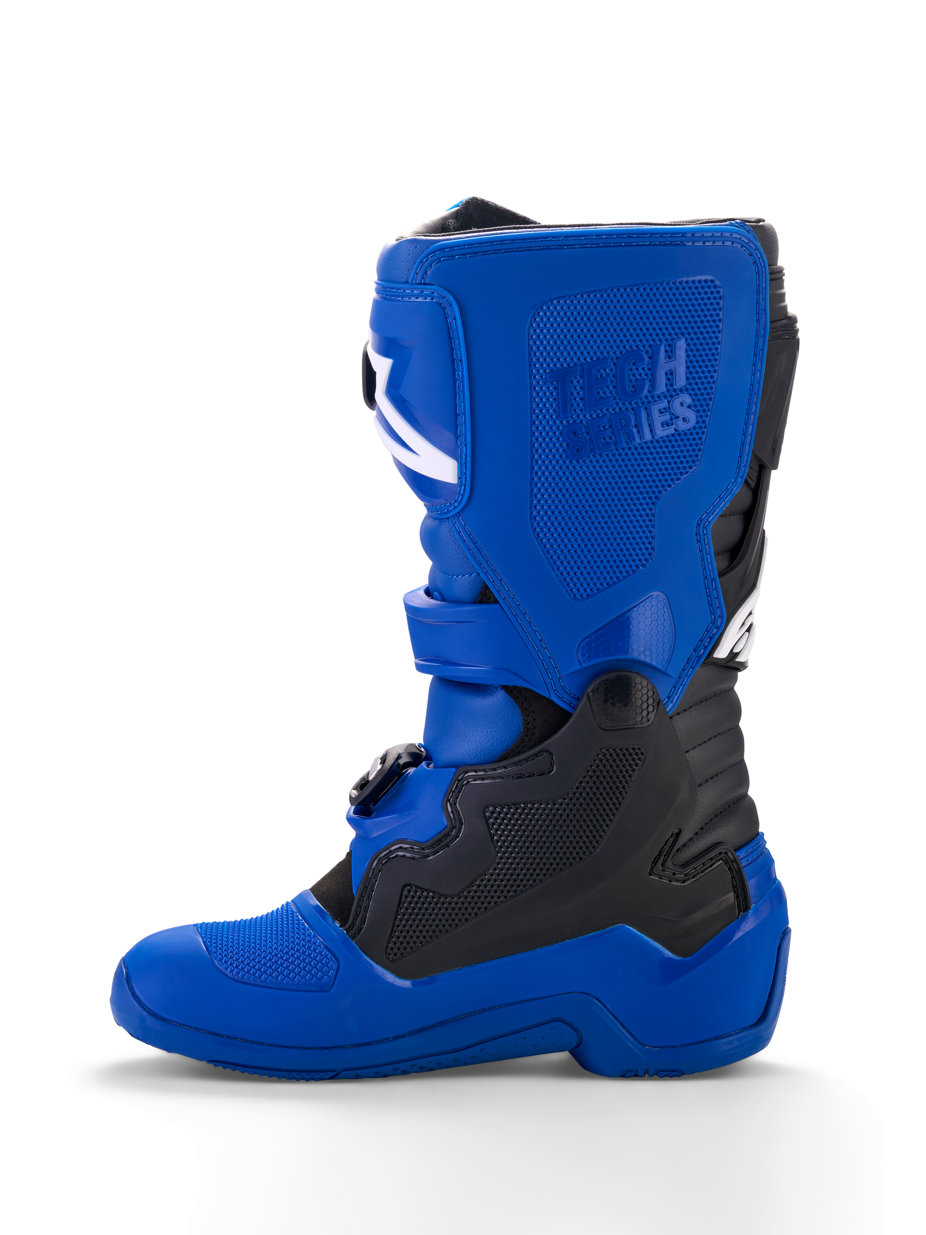 Alpinestars Yamaha Youth Tech 7S Boots, stivali da motocross per ragazzi, blu con accenti neri e bianchi, vista di profilo, con logo 'Tech Series' in rilievo, pannelli protettivi in TPU, sistema di chiusura con fibbie e suola blu resistente per prestazioni off-road