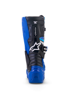 Stivali Alpinestars Yamaha Youth Tech 7S, stivali da motocross, blu, nero e bianco, vista posteriore con dettaglio della protezione in TPU su tallone e polpaccio, logo a stella bianco e design del sistema a perno resistente