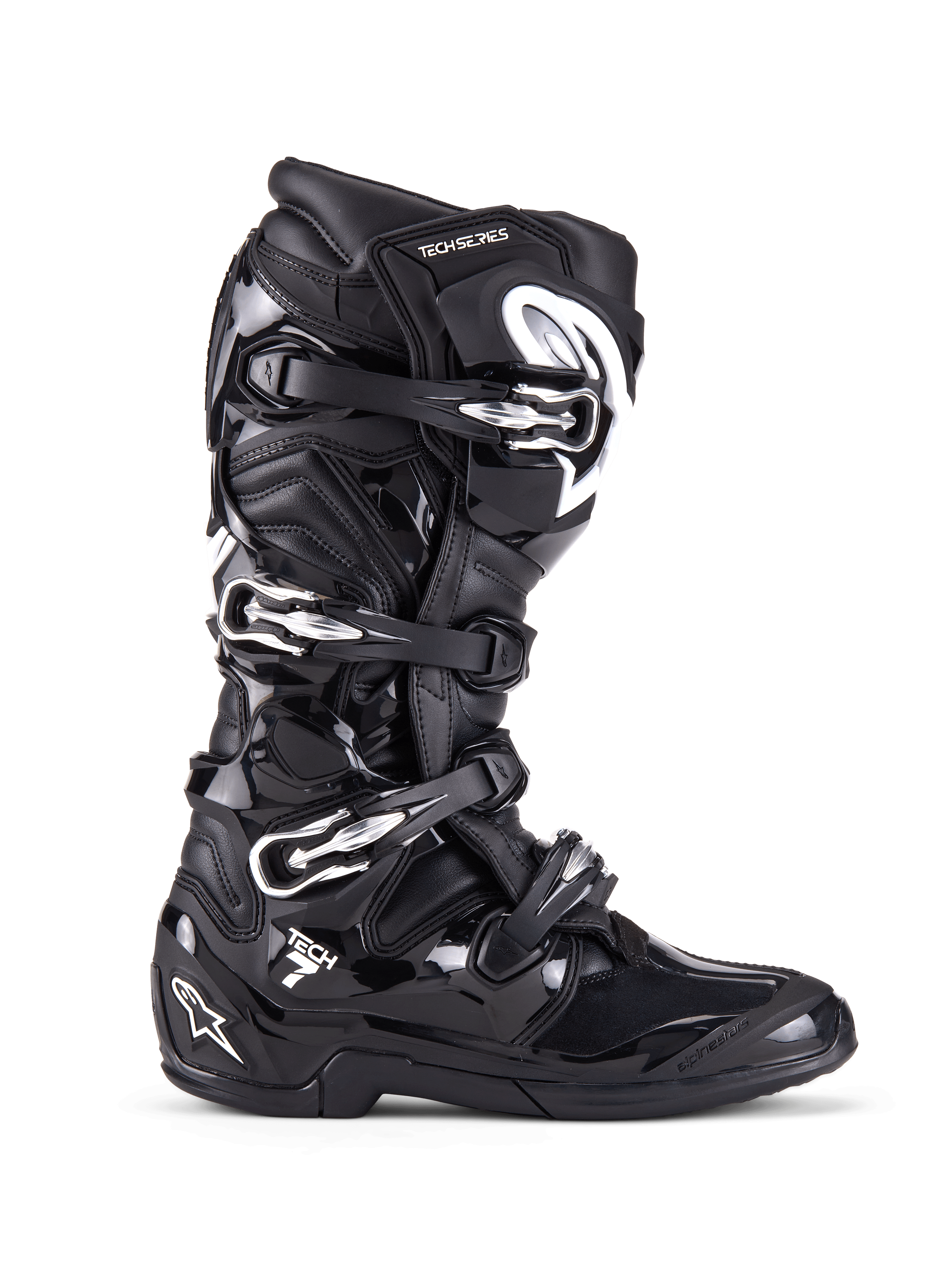 Alpinestars Tech 7, stivali da motocross fuoristrada, nero con fibbie argentate e accenti bianchi, vista laterale con quattro fibbie in alluminio a sgancio rapido, robusta calotta in TPU e pannelli testurizzati per protezione off-road