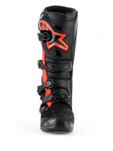 Alpinestars Tech 7 Boots, stivali da motocross, nero e rosso fluo, vista frontale, con grande logo a stella Alpinestars rosso fluo sulla piastra parastinchi, sistema di chiusura a quattro fibbie, costruzione in TPU resistente per corse off-road