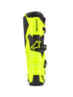Stivali da motocross Alpinestars Tech 7, giallo fluo e nero, vista posteriore con costruzione protettiva in TPU e contrafforte del tallone, logo Alpinestars in evidenza, design vivace ad alta visibilità per prestazioni off-road