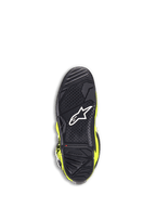 Stivali Alpinestars Tech 7, stivali da motocross, giallo fluo e nero, vista dal basso della suola in gomma nera con trama a grip testurizzato, logo stella bianco e indicatore di limite di usura rosso per la durata nel fuoristrada