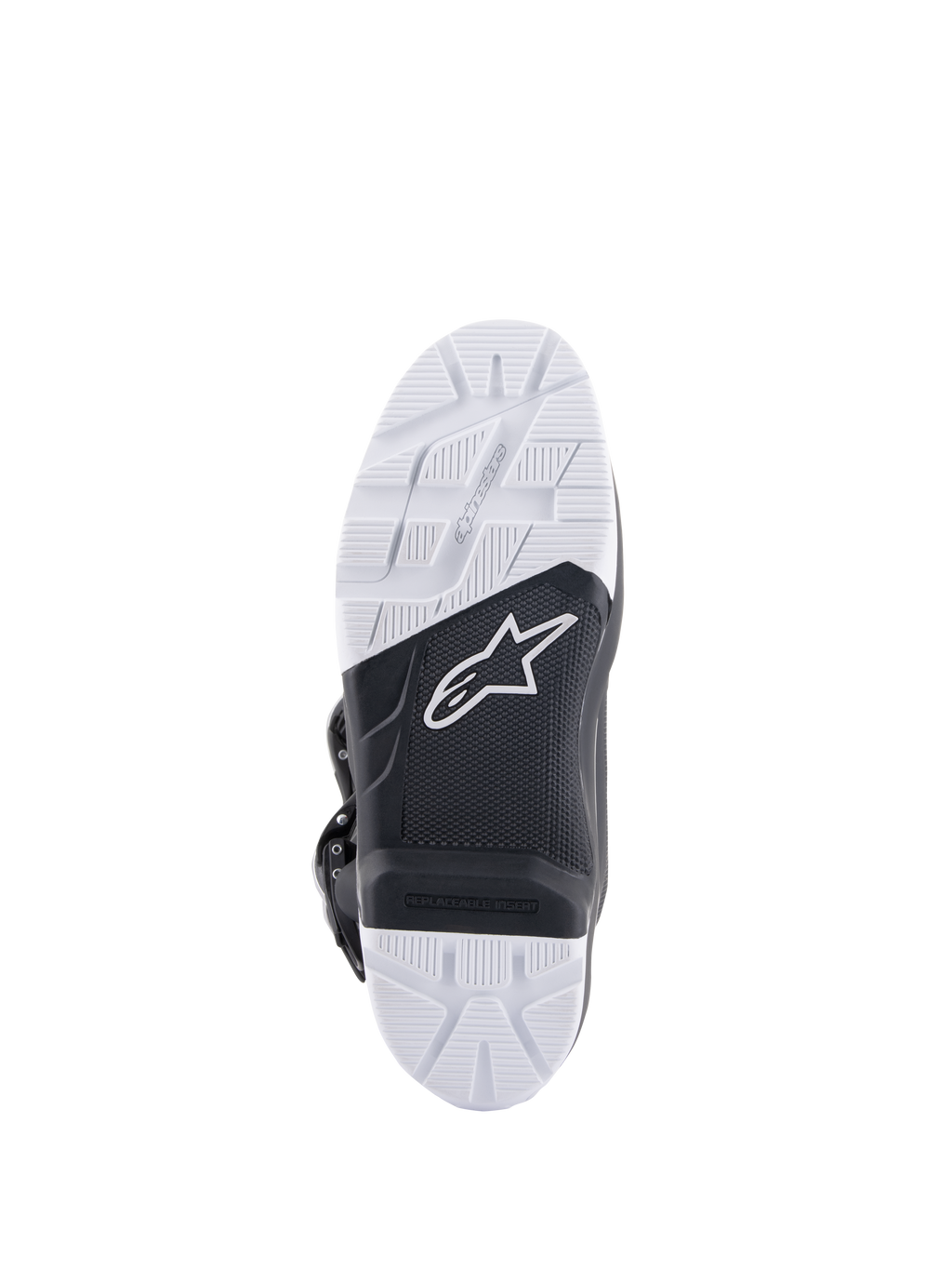 Stivali Alpinestars Tech 7 Enduro, vista della suola che mostra la suola in mescola specificamente progettata, design bicolore bianco e nero con motivi di grip strutturati, con logo a stella bianco e inserto per pedana sostituibile.