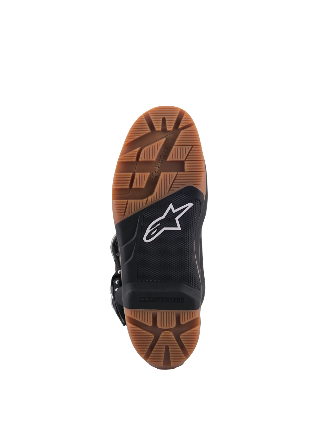 Stivali Alpinestars Tech 7 Enduro, vista ravvicinata della suola con battistrada in gomma marrone, sezione centrale nera con logo a stella bianco, inserto pedana sostituibile per un grip fuoristrada superiore