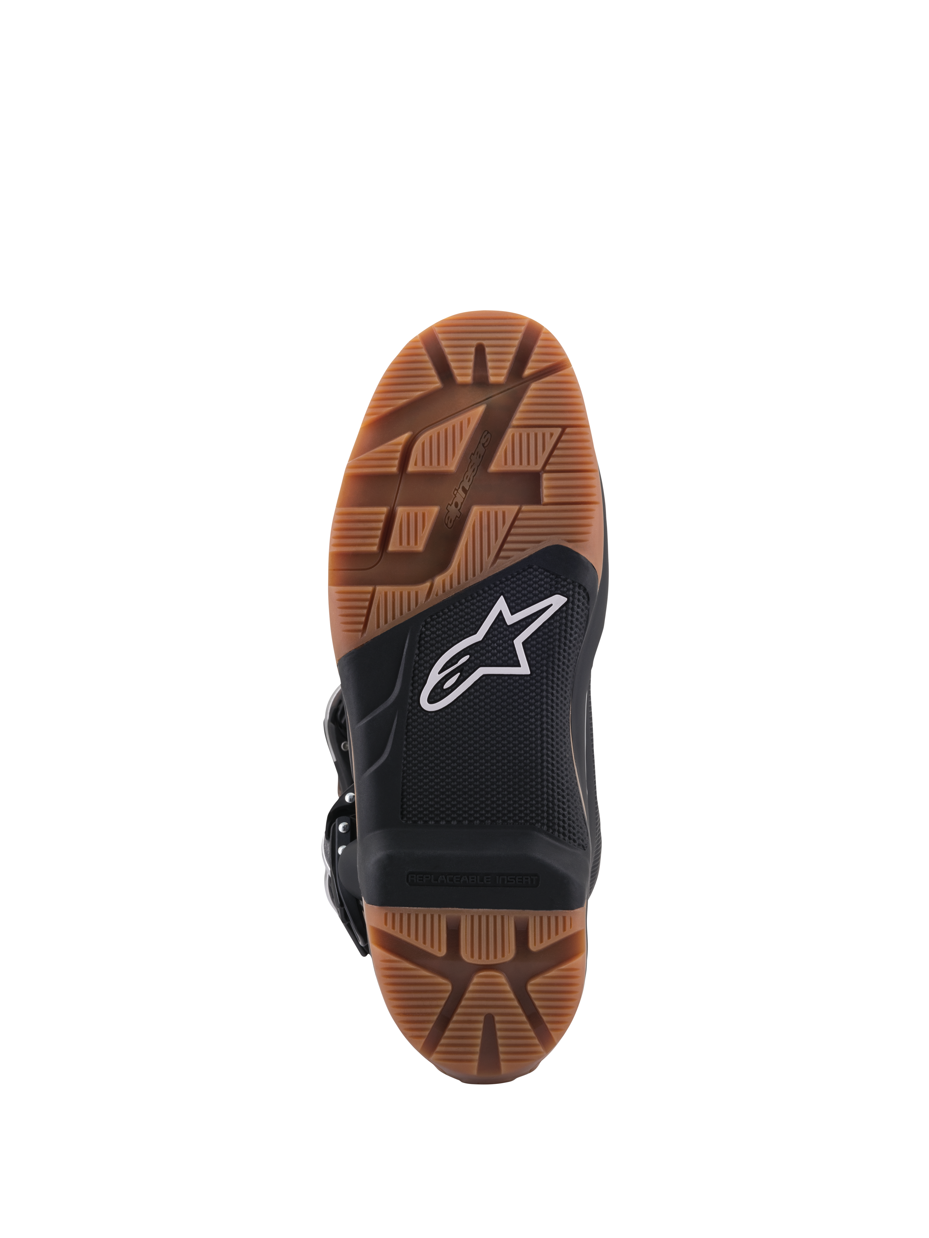 Stivali Alpinestars Tech 7 Enduro, vista ravvicinata della suola con battistrada in gomma marrone, sezione centrale nera con logo a stella bianco, inserto pedana sostituibile per un grip fuoristrada superiore