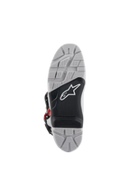 Stivali Alpinestars Tech 7 Enduro, vista della suola, suola a doppia mescola grigia e nera con logo a stella bianco, battistrada con trama profonda per la massima aderenza fuori strada, inserto per pedana sostituibile progettato per la durata nella guida enduro e off-road