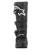 Stivali Alpinestars Tech 7 Enduro Drystar®, stivali da motocross neri, vista frontale con grande logo a stella bianco sulla tibia, sistema di chiusura a quattro fibbie, robusta costruzione in TPU per guida enduro e fuoristrada