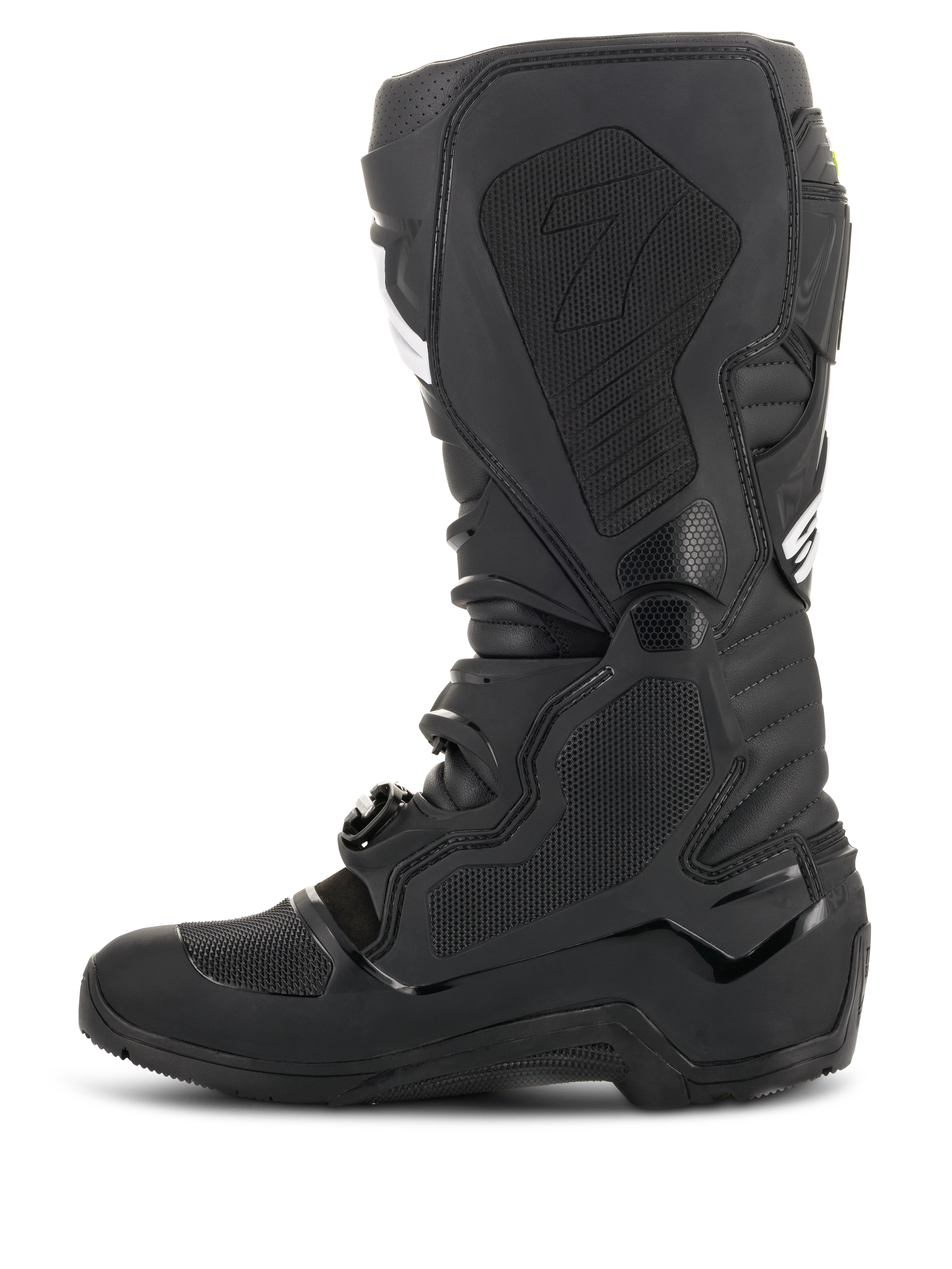 Stivali Alpinestars Tech 7 Enduro Drystar®, nero, vista di profilo del lato mediale con pannelli di aderenza a nido d'ape e logo '7', calzature da moto fuoristrada impermeabili per gare di enduro