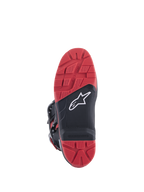 Stivali Honda Tech 7 Enduro Drystar®, nero e rosso brillante, vista della suola con battistrada ad alta aderenza e inserto sostituibile, struttura in gomma a doppia densità, logo Alpinestars bianco su pannello nero testurizzato.