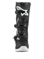 Stivali Alpinestars Tech 3 Enduro Waterproof, stivali da motocross ed enduro, nero e bianco, vista frontale con grande logo a stella bianco sulla piastra tibiale in TPU, sistema di chiusura a tre fibbie e robusta suola bianca per trazione fuoristrada.