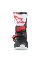Stivali Alpinestars Tech 3S Bambino, stivali da motocross, bianco, nero e rosso brillante, vista frontale che mostra la piastra tibiale bianca con logo rosso, struttura nera con cinturini delle fibbie rossi, calzatura protettiva da fuoristrada per giovani piloti