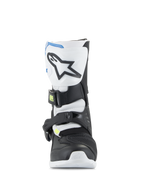 Stivali Alpinestars Kids Tech 3S, stivali da motocross per ragazzi, bianco, nero e blu smalto, profilo frontale che mostra la piastra parastinchi in TPU con logo a stella, pannelli neri e bianchi e sistema di chiusura sicura con fibbia