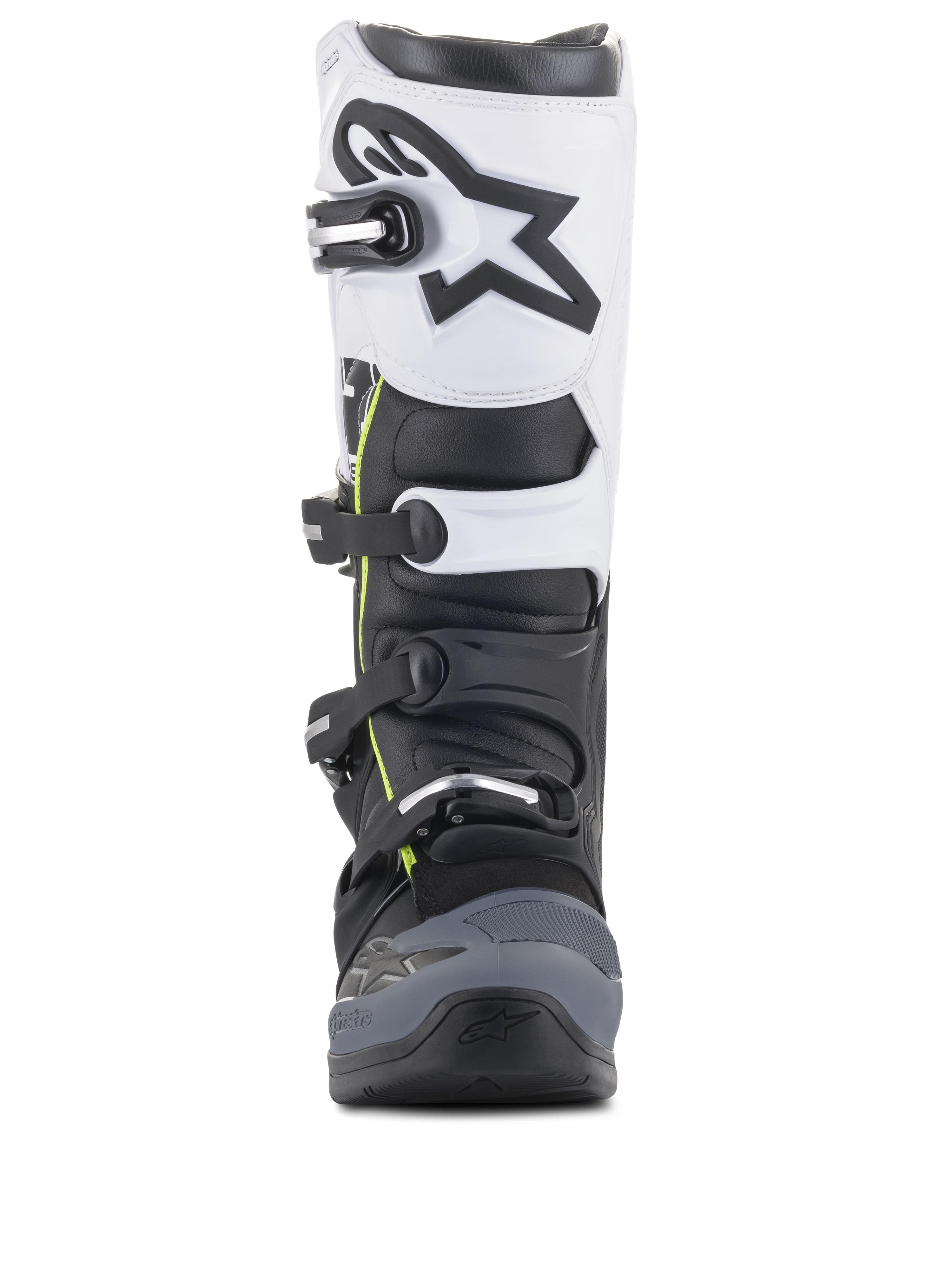 Stivali Alpinestars Tech 5, stivali da motocross, nero, grigio scuro e bianco, vista frontale con sistema di chiusura multi-fibbia, pannello superiore bianco con logo Astars nero, punta rinforzata grigio scuro e discreti accenti gialli
