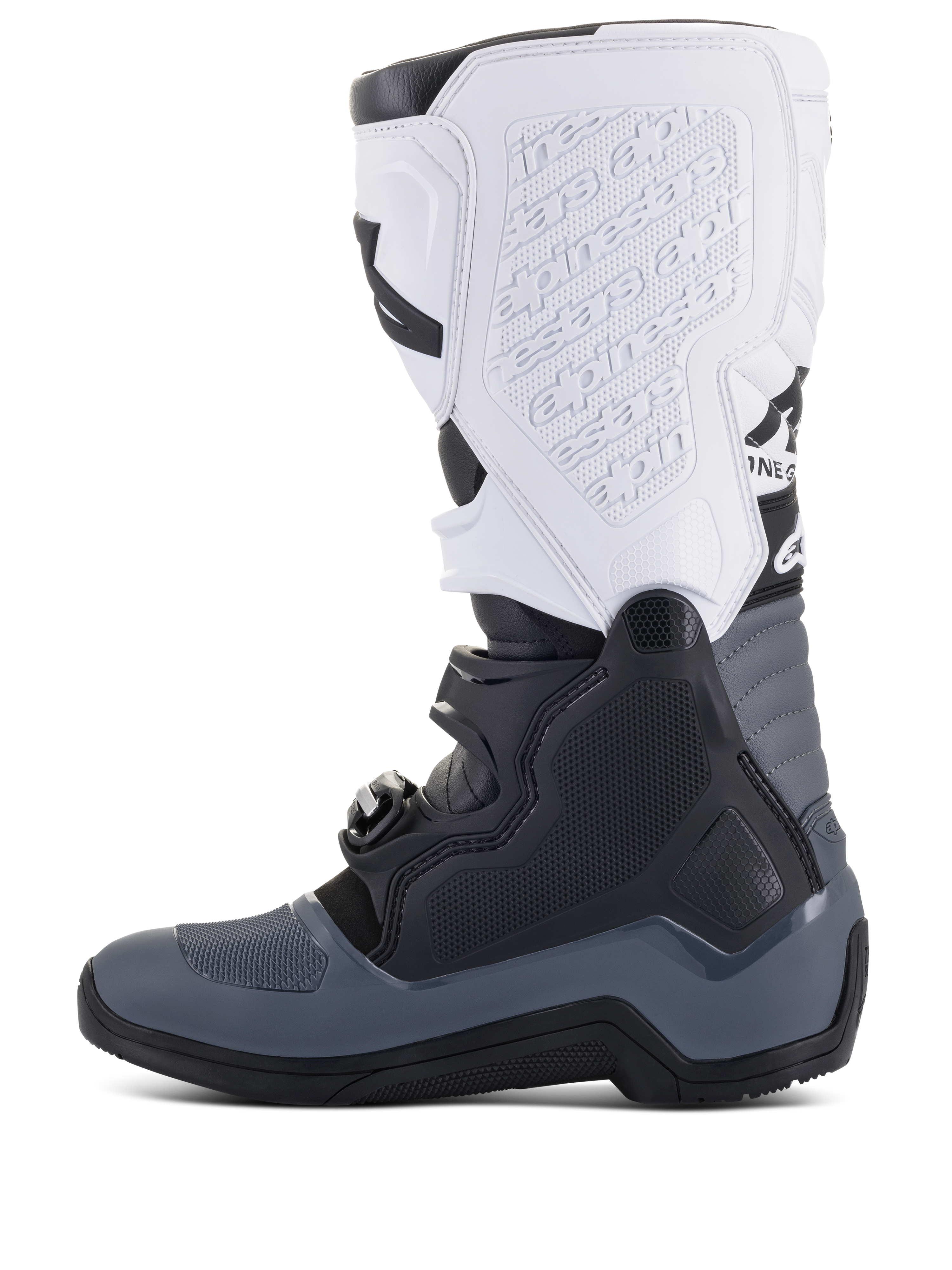 Stivali Alpinestars Tech 5, stivali da motocross, nero, grigio scuro e bianco, vista laterale con chiusure a fibbia multiple, marchio in rilievo sulla placca tibiale bianca e costruzione robusta per prestazioni fuoristrada