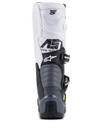 Alpinestars Tech 5 Boots, stivali da motocross, nero, grigio scuro e bianco, vista posteriore che mostra la tomaia bianca con marchio Tech 5, zone di flessione a fisarmonica grigie e protezione del tallone nera con logo Tech Series