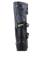 Alpinestars Stivali Tech 5, stivali da motocross, nero, grigio e giallo fluo, vista posteriore con zone di flessione a soffietto e protezione del tallone, con logo Astars giallo e branding Tech Series in rilievo, costruzione multi-materiale resistente per prestazioni fuoristrada