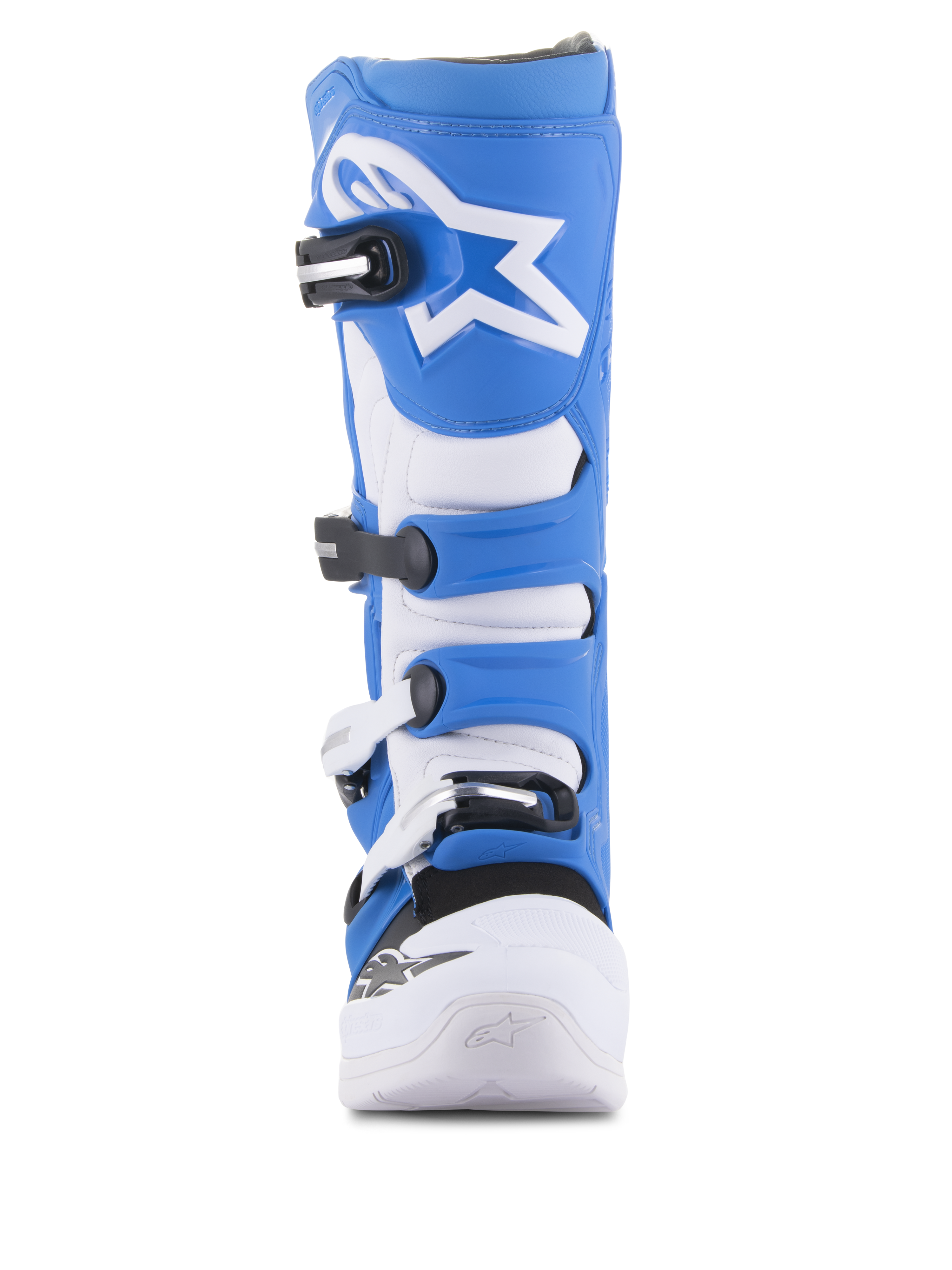 Stivali Alpinestars Tech 5, stivali da motocross, blu e bianco, vista frontale, dotati di sistema di chiusura a quattro fibbie, logo Alpinestars a stella bianco sulla placca tibiale blu e telaio in microfibra resistente con punta bianca rinforzata.