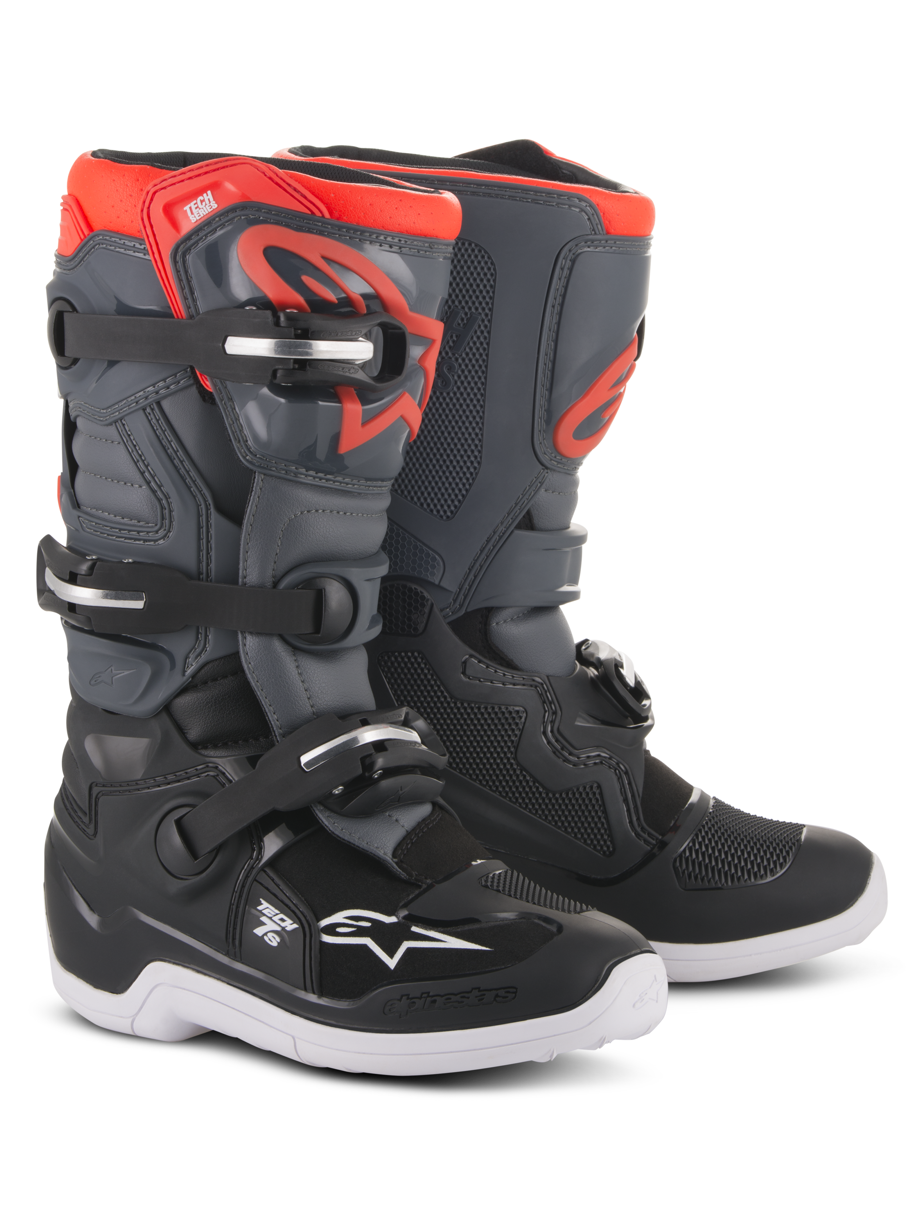 Stivali Alpinestars Youth Tech 7S, stivali da motocross, nero, grigio scuro e rosso fluorescente, con sistema di chiusura a quattro fibbie, piastra parastinchi protettiva in TPU, suola esterna bianca e logo Alpinestars rosso, progettati per giovani piloti off-road