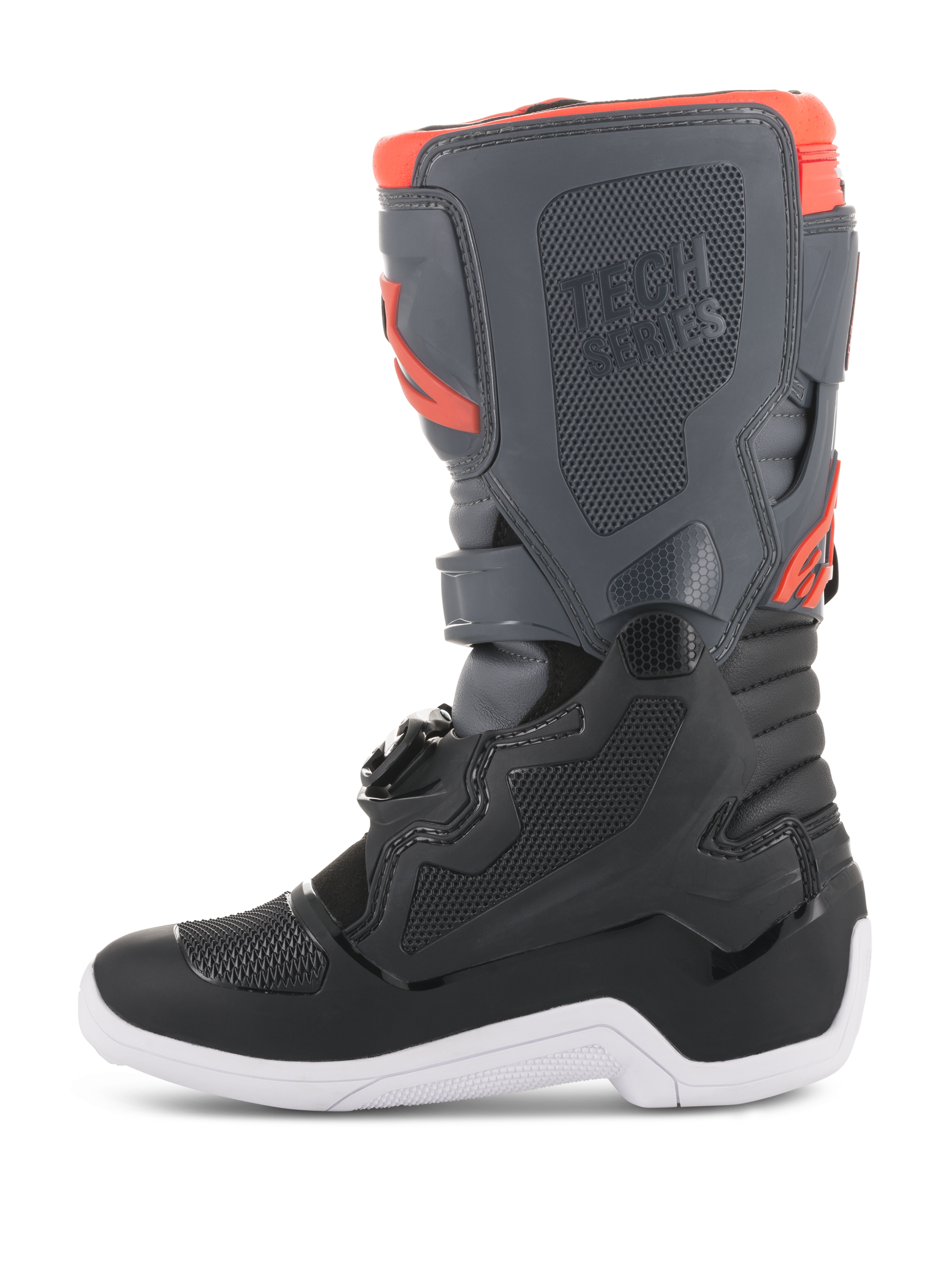 Stivali Alpinestars Youth Tech 7S, stivali da motocross, nero, grigio scuro e rosso fluorescente, vista laterale con pannelli protettivi in TPU, marchio Tech Series e suola bianca