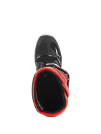 Stivali Alpinestars Youth Tech 7S, stivali da motocross, nero e rosso fluorescente, vista dall'alto verso l'interno della fodera rossa, con guscio esterno nero, logo a stella bianco e struttura sintetica resistente